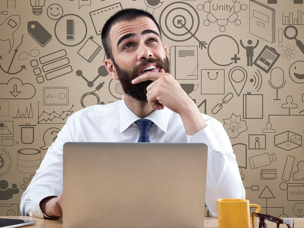 Business professional considering agency options at a laptop
