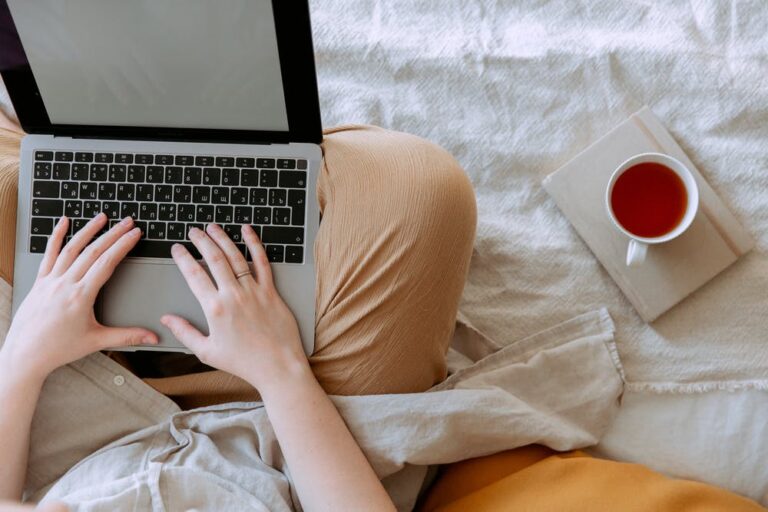 Person typing on a laptop, illustrating digital content and campaign work